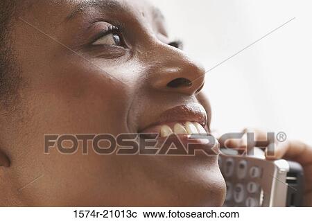 Close-up of a businesswoman talking on the phone View Large Photo Image Stock Image - Close-up of a businesswoman talking on the phone. Fotosearch