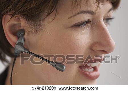 Close-up of a businesswoman using a hands free device View Large Photo Image Stock Image - Close-up of a businesswoman using a hands free device. Fotosearch