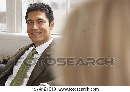 Portrait of a businessman smiling View Large Photo Image Stock Image - Portrait of a businessman smiling. Fotosearch