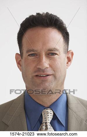 Portrait of a businessman smiling View Large Photo Image Stock Image - Portrait of a businessman smiling. Fotosearch