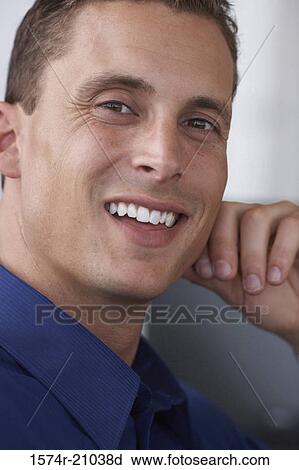 Stock Image - Portrait of a businessman smiling. Fotosearch