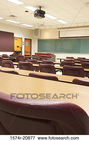Empty tables and chairs in a lecture hall View Large Photo Image Stock Photo - Empty tables and chairs in a lecture hall. Fotosearch