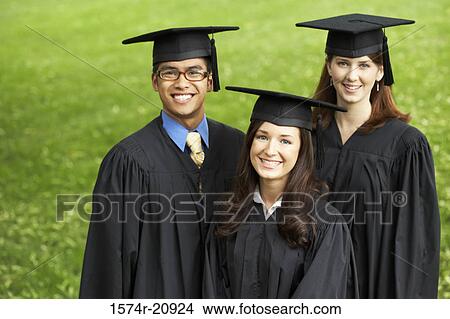 Portrait of two female graduates and a male graduate smiling View Large Photo Image Picture - Portrait of two female graduates and a male graduate smiling. Fotosearch