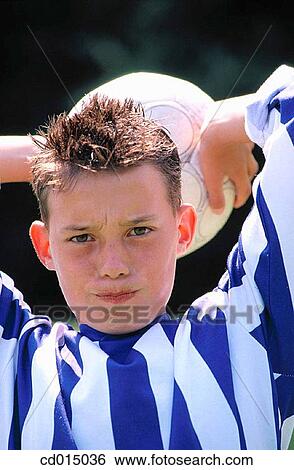 Stock Photograph - activity, boy, black hair, ball, action. Fotosearch