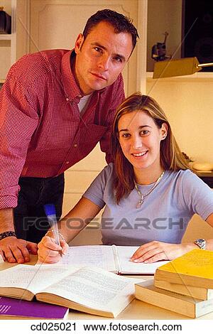Stock Image - adolescence, book, at-home, activity. Fotosearch