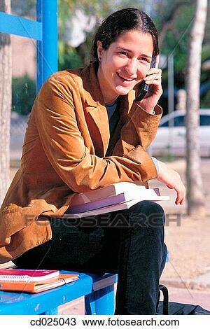 adolescence, calling, brunette, book, activity View Large Photo Image Stock Image - adolescence, calling, brunette, book, activity. Fotosearch