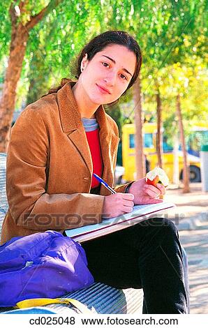 adolescence, College student, brunette, apple, activity View Large Photo Image Stock Photo - adolescence, College student, brunette, apple, activity. Fotosearch