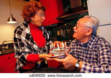 affection, birthday, at-home, aged, action View Large Photo Image Stock Photography - affection, birthday, at-home, aged, action. Fotosearch