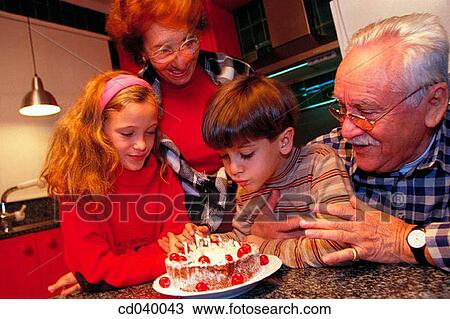 Stock Image - aged, birthday, at-home, affection. Fotosearch