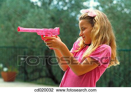 Stock Image - aiming, child, blond, amusement, aim. Fotosearch