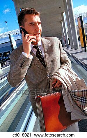 Stock Image - airport, businessman, business, briefcase, activity. Fotosearch