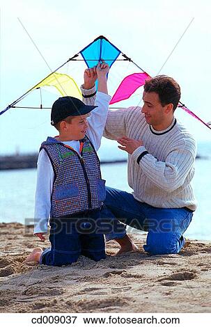 Stock Photo - amusement, boy, beach, activity. Fotosearch