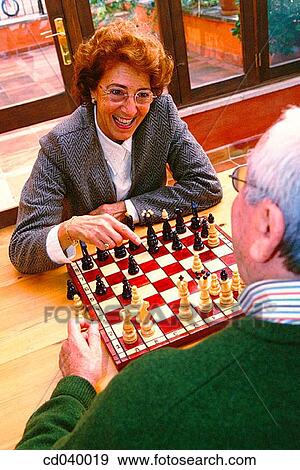 Stock Photo - amusement, chess, board, at-home, activity. Fotosearch