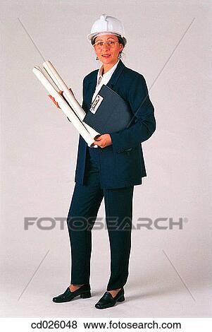 Stock Photo - architect, brunette, blueprint, activity. Fotosearch