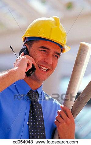 Stock Photo - Architect talking on cell phone. Fotosearch