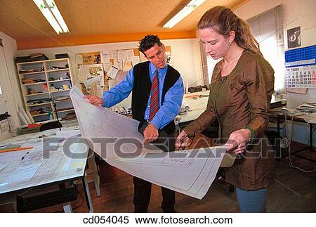 Architects looking arquitectural plans View Large Photo Image Stock Photography - Architects looking arquitectural plans. Fotosearch