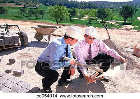 Architects looking at plans View Large Photo Image Picture - Architects looking at plans. Fotosearch