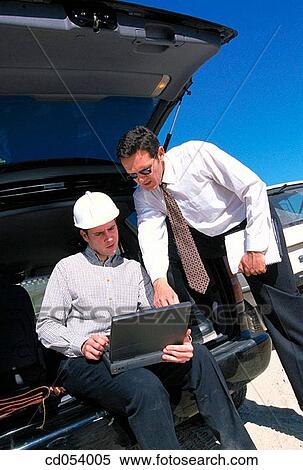 Stock Photography - Architects using laptop computer. Fotosearch