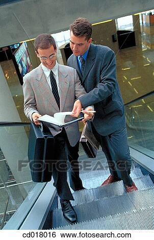 Stock Photograph - ascending, businessman, business, briefcase, ascend. Fotosearch