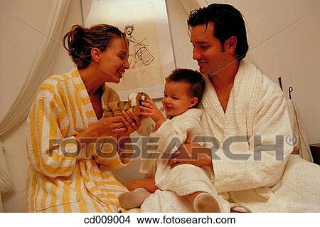 Picture - at-home, boy, bathrobe, baby, amusement. Fotosearch