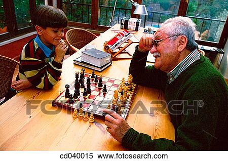 Stock Photography - at-home, boy, board, activity. Fotosearch
