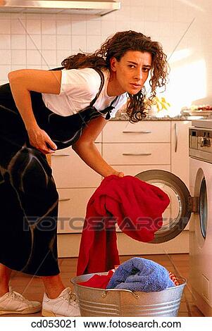 Stock Image - at-home, clothes, brunette, activity. Fotosearch
