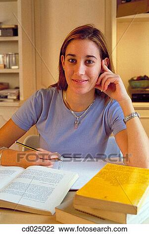 Stock Image - at-home, College student, book, adolescence. Fotosearch