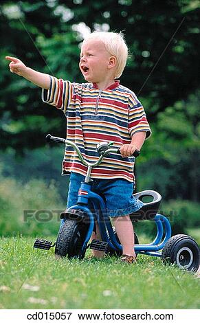 Stock Photo - Attracting attention, boy, blond, baby, angry. Fotosearch