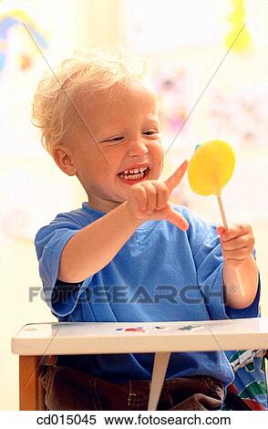 baby, carefree, boy, blond, absorbed View Large Photo Image Stock Photography - baby, carefree, boy, blond, absorbed. Fotosearch