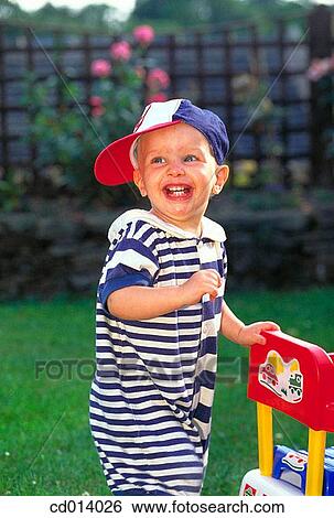 baby, child, cap, boy, amusement View Large Photo Image Stock Photograph - baby, child, cap, boy, amusement. Fotosearch