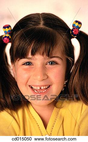 Stock Image - Baby teeth, brunette, carefree, child. Fotosearch