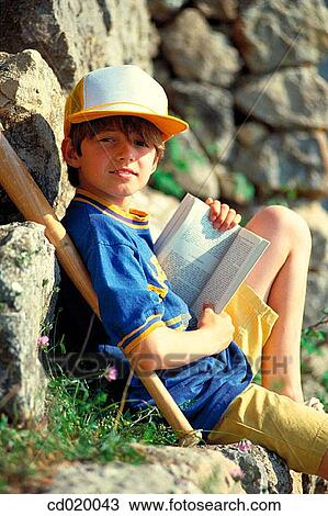 Stock Image - Baseball bat, book, boy, cap, child. Fotosearch
