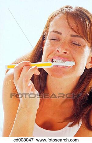 Stock Photo - beauty, brush, brunette, Beauty Care, activity. Fotosearch