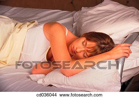 Picture - bed, brunette, bedroom, at-home. Fotosearch