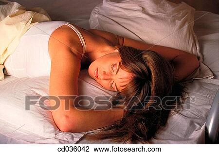 bed, brunette, bedroom, at-home View Large Photo Image Stock Image - bed, brunette, bedroom, at-home. Fotosearch