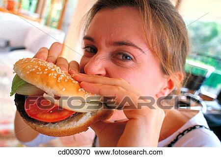 bite, burger, biting, activity View Large Photo Image Stock Image - bite, burger, biting, activity. Fotosearch