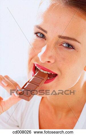Stock Photograph - bite, chocolate, biting, activity. Fotosearch