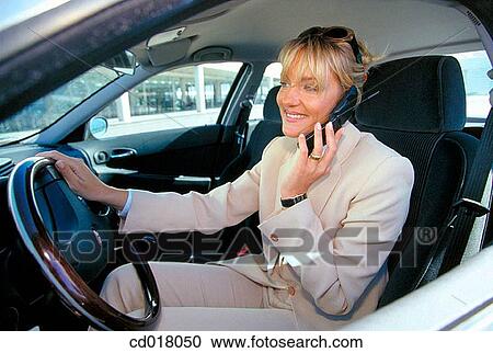 Stock Image - blond, businesswoman, businesspeople, business, automobile. Fotosearch