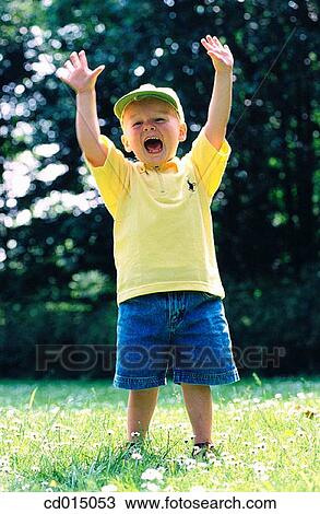 blond, carefree, cap, boy, amusement View Large Photo Image Stock Image - blond, carefree, cap, boy, amusement. Fotosearch