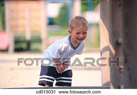 Stock Image - blond, child, carefree, boy, amusement. Fotosearch