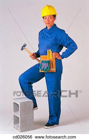 Stock Photograph - blue, carpenter, brunette, boilersuit, activity. Fotosearch