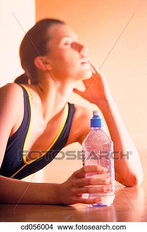 Picture - bottle, brunette, break-time, break, activity. Fotosearch
