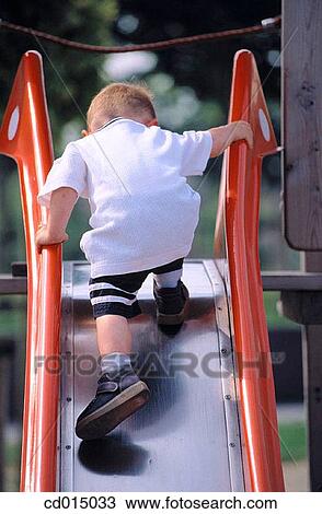 boy, amusement, balance, back view, ascending, ability View Large Photo Image Stock Image - boy, amusement, balance, back view, ascending, ability. Fotosearch