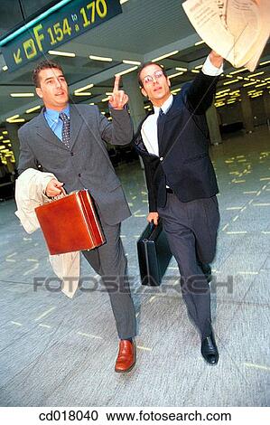 Stock Image - briefcase, businesspeople, businessman, business, airport. Fotosearch