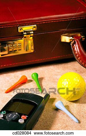 Picture - Briefcase, mobile phone, golf ball and tees. Fotosearch