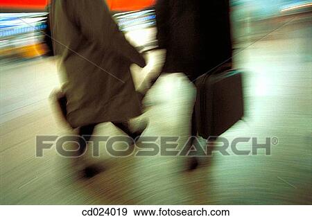 Stock Photo - business, activity, briefcase, blurred motion, airport, action. Fotosearch