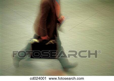 Stock Image - businessman, activity, business, briefcase, blurred motion, action. Fotosearch
