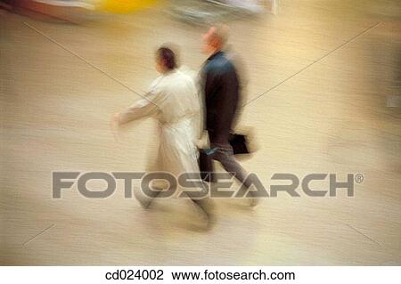 Stock Image - businessman, activity, business, briefcase, blurred motion, action. Fotosearch