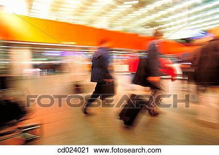 Stock Image - businessman, activity, business, blurred motion, airport, action. Fotosearch