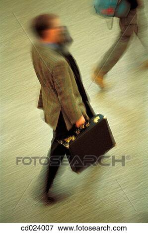 Stock Photo - businessman, activity, business, briefcase, blurred motion, action. Fotosearch